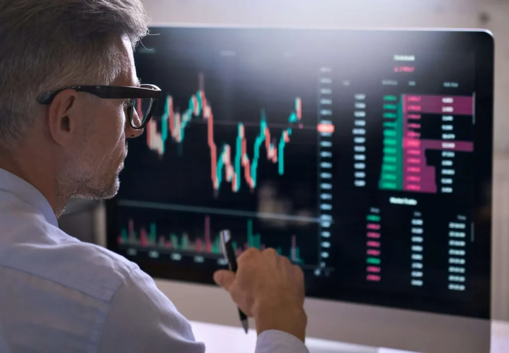 crypto trader investor using computer analyzing cryptocurrency stock market