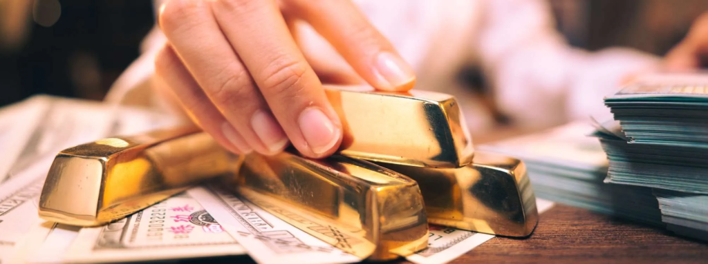 Aml For Gold And Precious Metals Dealers In Dubai, Uae 1 the hand holding the precious gold bar shows the success of the finance business
